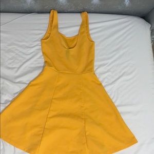 A yellow mid length dress